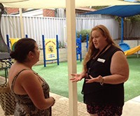 Staff member talking to guest