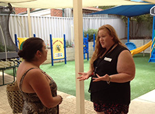 Staff member talking to guest