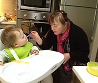 Bettina feeding her baby nephew