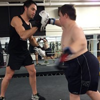 Dale boxing with trainer in the ring