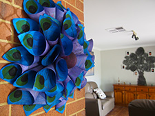 Elsa's peacock wreath