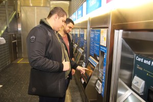 Jess paying for his train ticket.