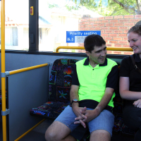 Simon practises traveling to work with his support worker.