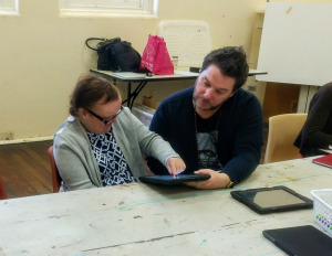 Mandy creating her artwork with one of the DADAA mentors