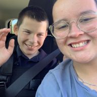 Lochie and his Identitywa support worker in Abi's car